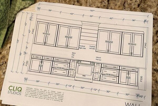 Blueprints for custom kitchen cabinet installation by Lewis Roofing & Construction