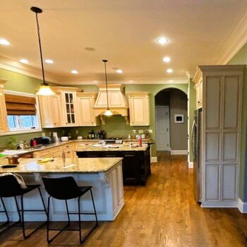 custom kitchen cabinets and lighting by Lewis Roofing & Construction