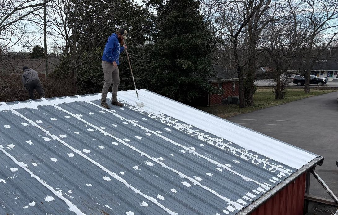 Workers at Lewis Roofing & Construction resurface commercial roof